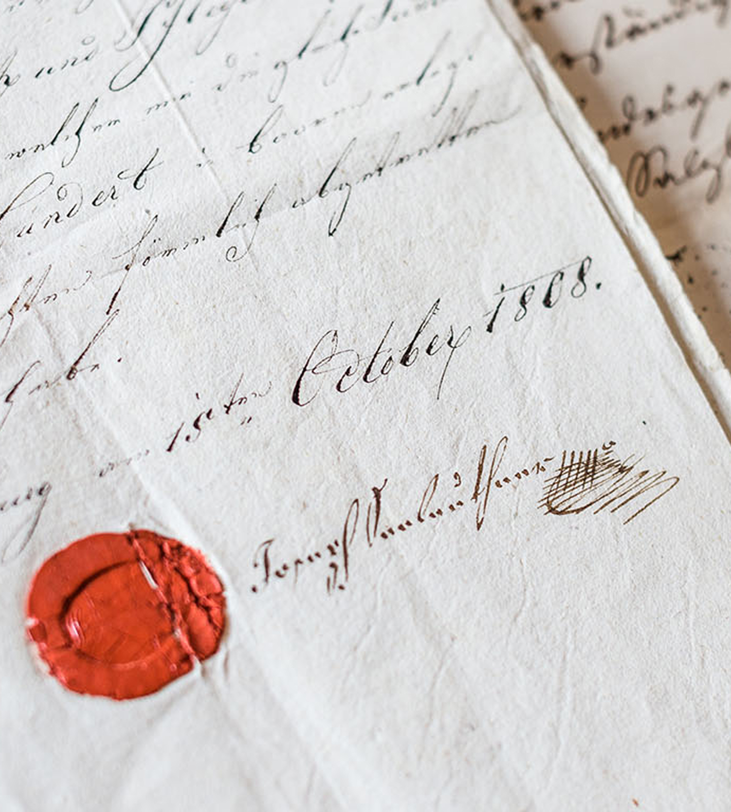 Altes Dokument in Schreibschrift mit dem Datum "15ten October 1808", einer Unterschrift und einem roten Wachssiegel.